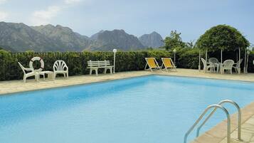 Seasonal outdoor pool, pool umbrellas, pool loungers