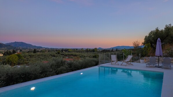 Outdoor pool, open 8:00 AM to 8:00 PM, pool umbrellas, sun loungers