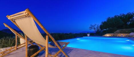 Outdoor pool, open 8:00 AM to 8:00 PM, pool umbrellas, sun loungers