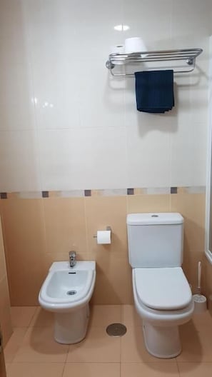 Family Room, Shared Bathroom | Bathroom | Hair dryer, towels