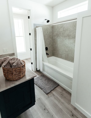 Combined shower/tub, hair dryer, towels, soap