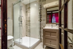 Shower, hair dryer, towels, soap