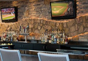 Relax with a drink at the bar, where flat-screen TVs display live sports and a wine cooler is always stocked.