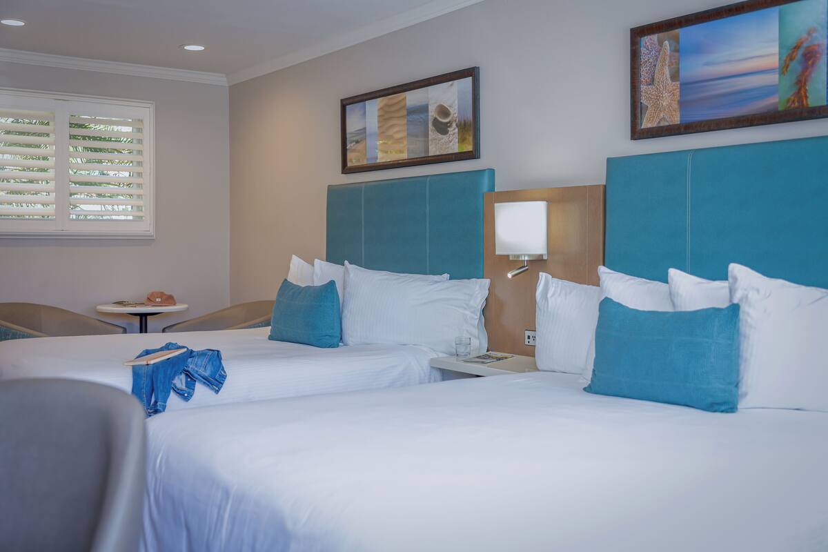 Family Room, 2 Queen Beds | Hypo-allergenic bedding available, in-room safe, desk, laptop workspace