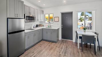 Villas 1 Bedroom King Suite Poolside | Private kitchen | Coffee/tea maker, cleaning supplies, paper towels