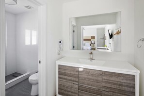 Villas King Suite Partial Ocean View | Bathroom | Shower, hair dryer, towels, soap - The Villas at St Pete Beach (St. Pete Beach)