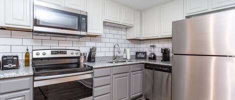 Microwave, dishwasher, coffee/tea maker, cookware/dishes/utensils