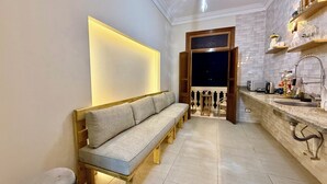 A modern kitchen with a built-in oven, a sink, and a countertop. - Bella Casa Hostel (Cairo)