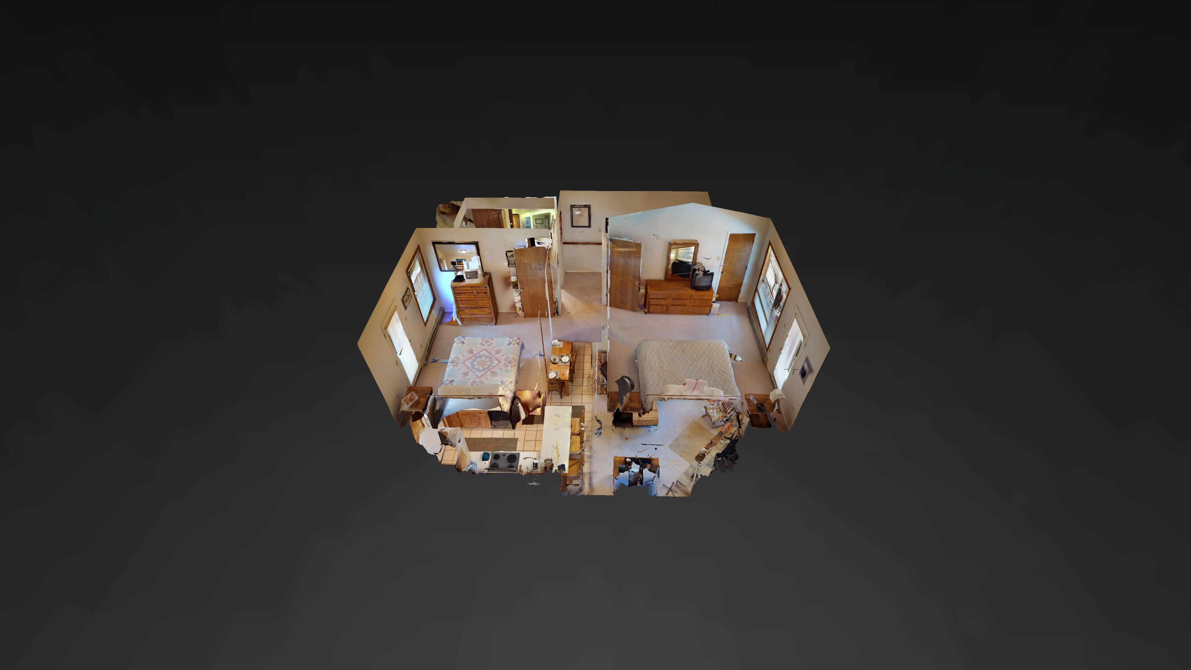 Ein 3D-Grundriss eines Hotelzimmers mit Bett, Schreibtisch, Stuhl, Kleiderschrank und einem kleinen Badezimmer.