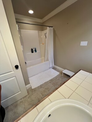 Combined shower/tub, hair dryer, towels, soap