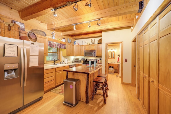 Enjoy cooking in this well-equipped kitchen with a refrigerator, microwave, and oven.