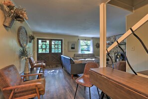 Relax in this inviting space with a comfortable seating area, large window, and decorative touches throughout.
