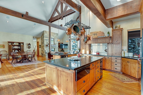 Enjoy cooking in this well-equipped kitchen with a large island and ample storage.