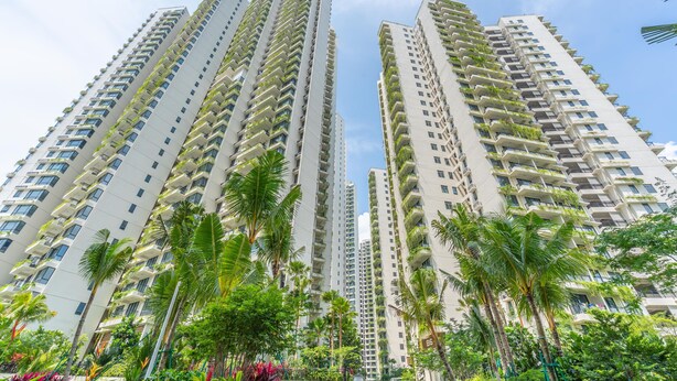 High-rise residential buildings with balconies, surrounded by lush greenery and palm trees. - OYO Home 89312 Fantastic 1 Bedroom Starview (Gelang Patah)