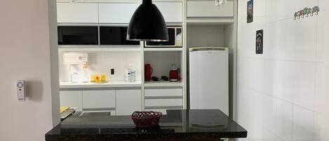 Fridge, stovetop, toaster, cookware/dishes/utensils