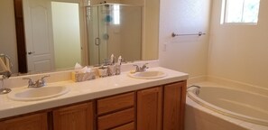 Combined shower/tub, hair dryer, towels, soap