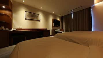 A hotel room with two beds, a desk, a flat-screen TV, and a painting on the wall.