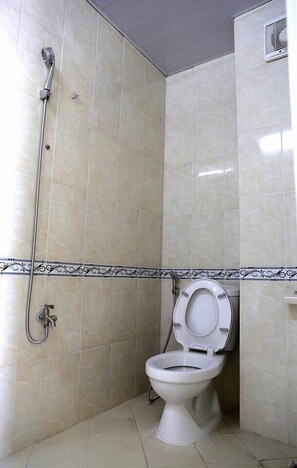 Shower, rainfall showerhead, slippers, towels