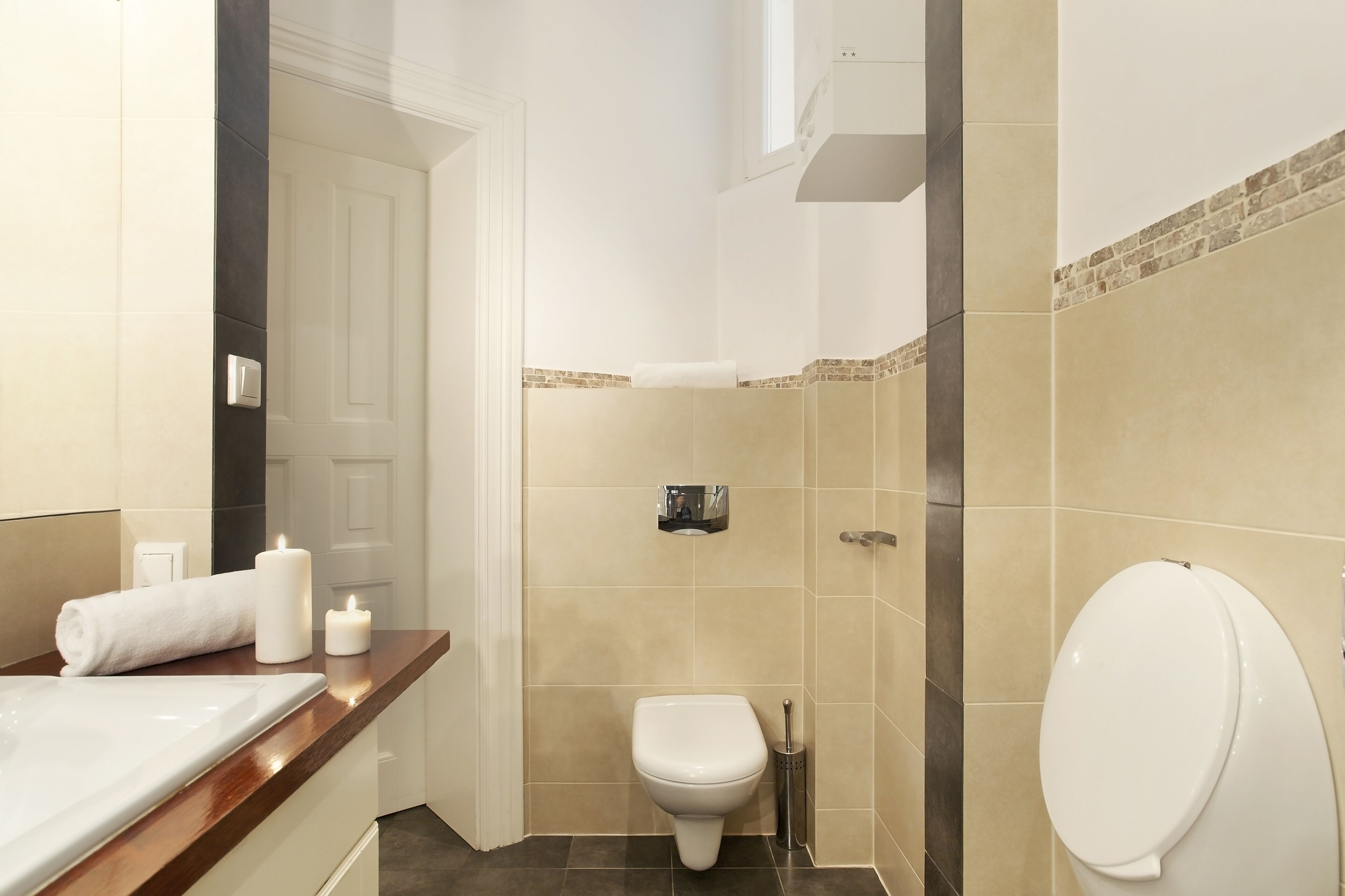 A bathroom with a bathtub, toilet, and shower.