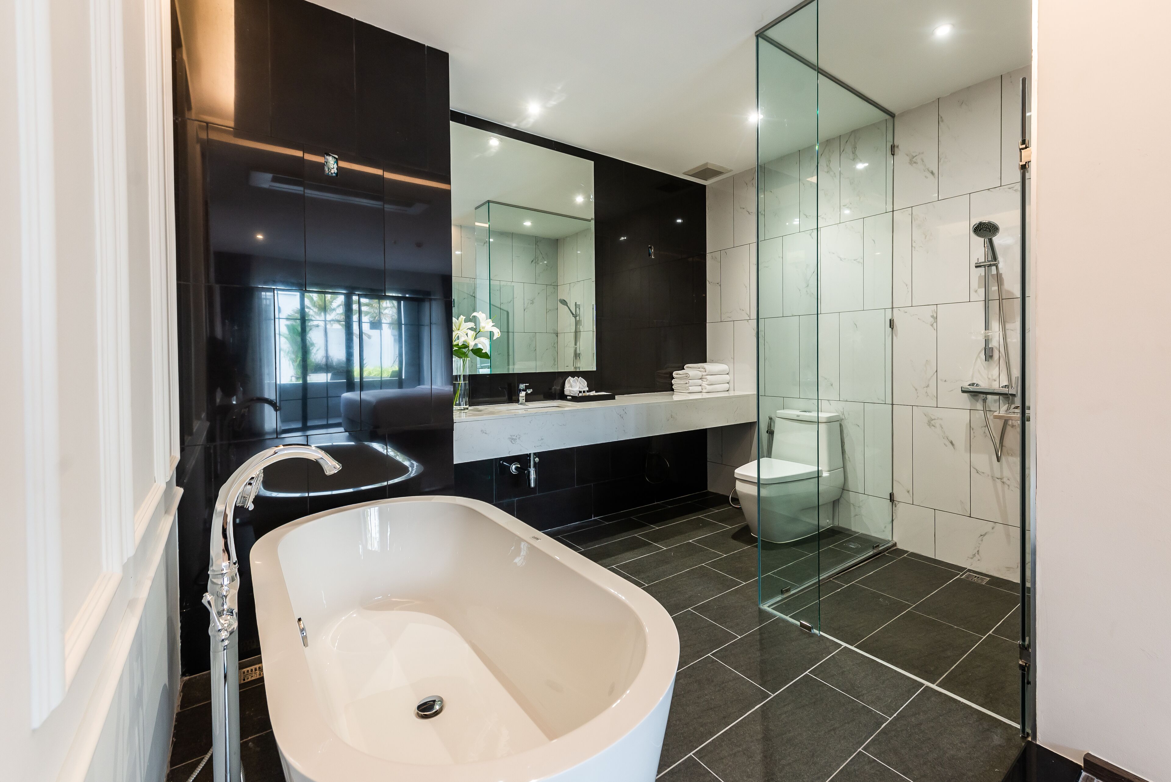 designer toiletries, hair dryer, bathrobes, slippers