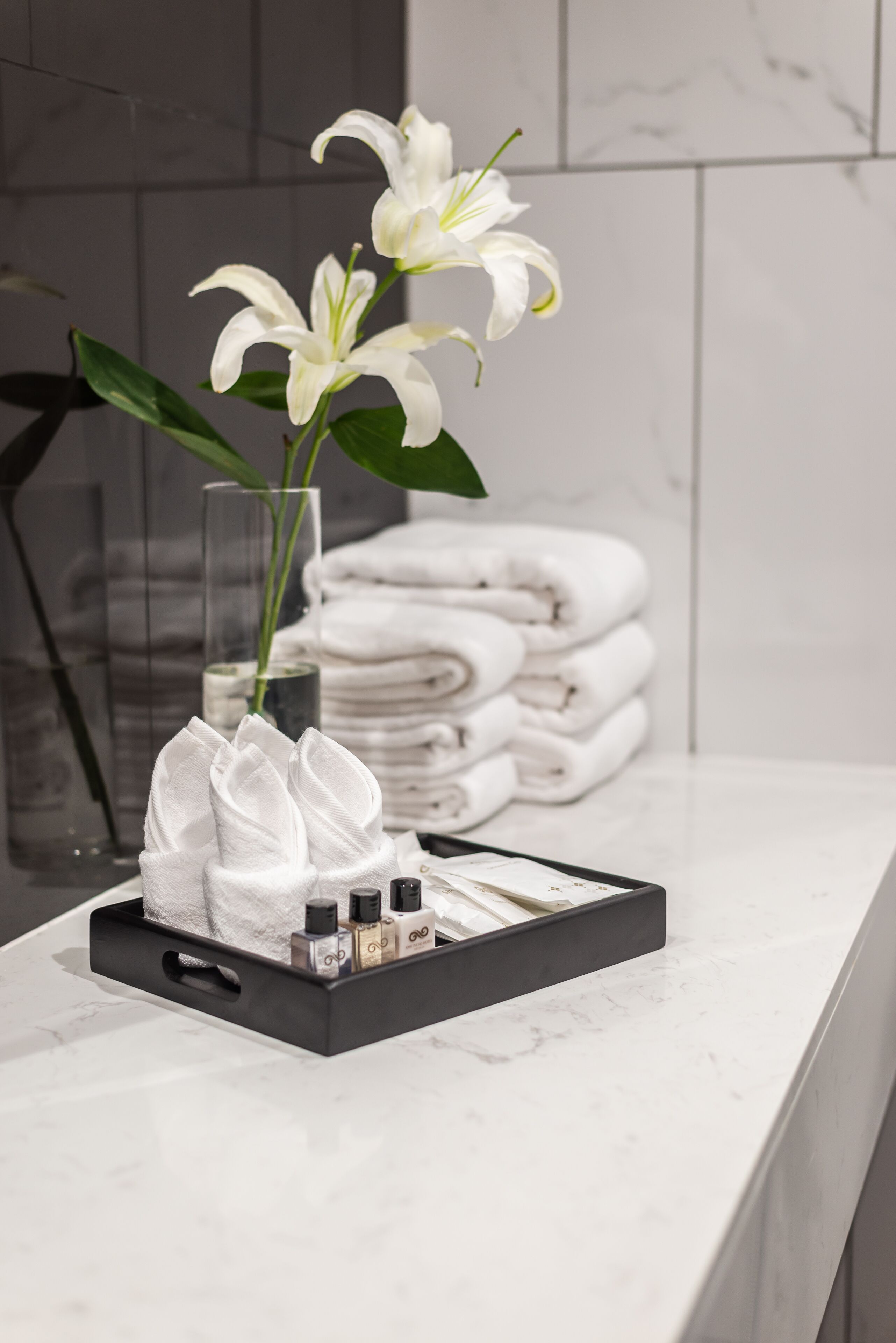 designer toiletries, hair dryer, bathrobes, slippers