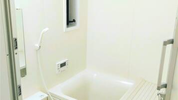 Building G | Bathroom | Separate bathtub and shower, free toiletries, hair dryer, slippers