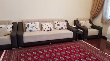 Comfort Apartment | Living room | 43-inch LED TV with satellite channels, TV