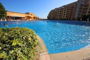 Seasonal outdoor pool, open 10:00 AM to 7:00 PM, pool umbrellas
