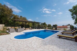 Outdoor pool, pool umbrellas, pool loungers