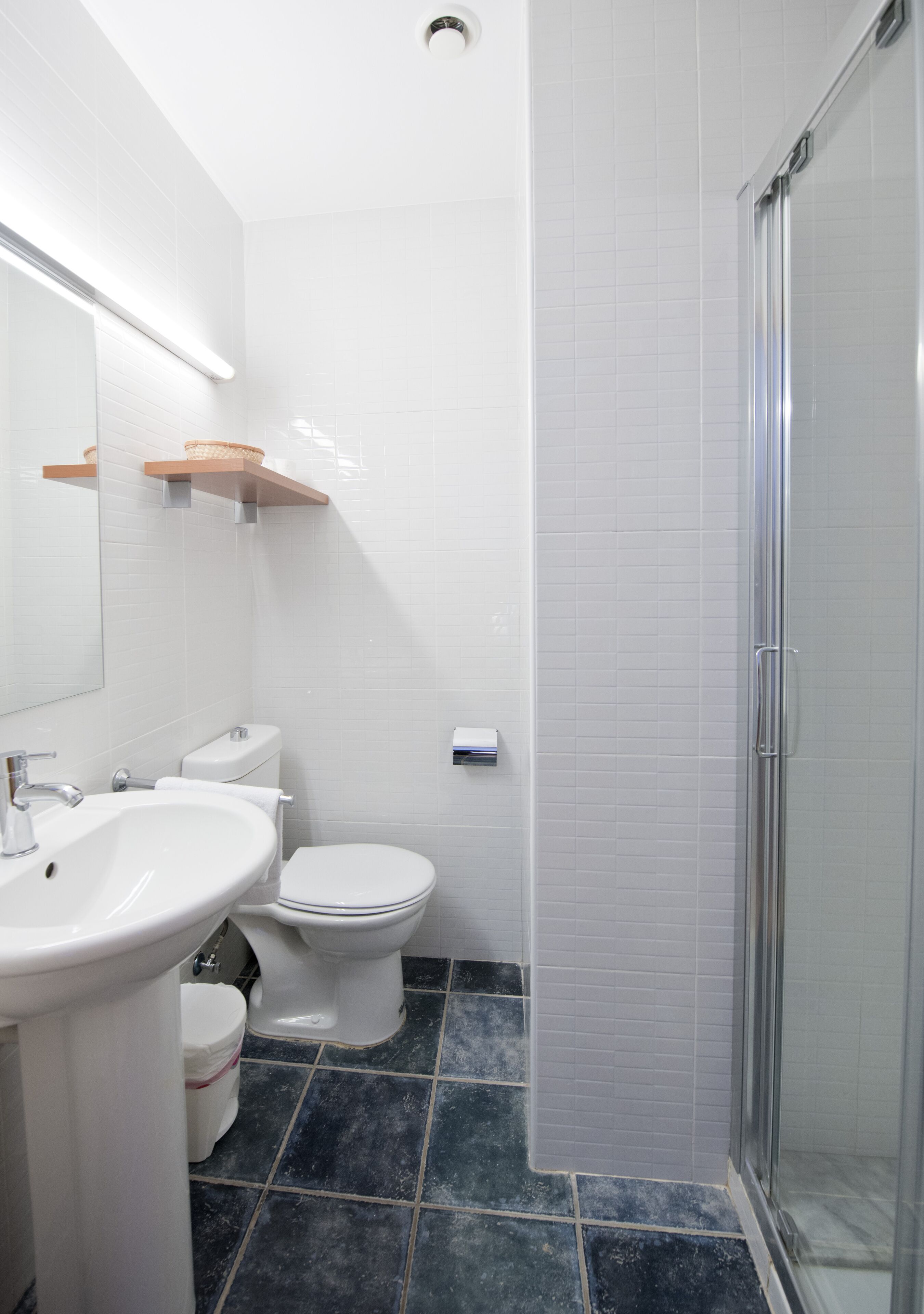 basic room | bathroom | shower, rainfall showerhead, hair dryer, towels