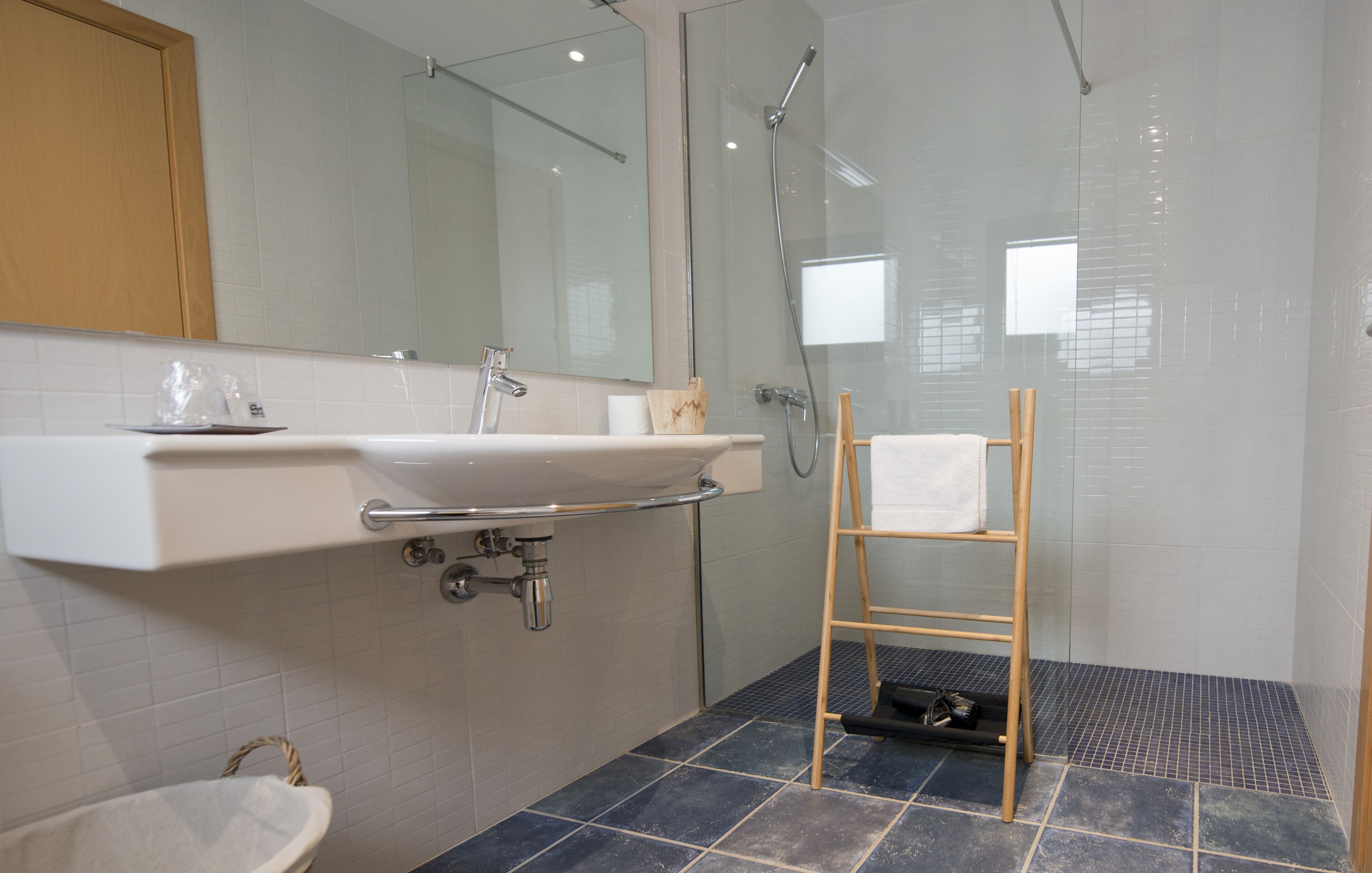 suite | bathroom | shower, rainfall showerhead, hair dryer, towels