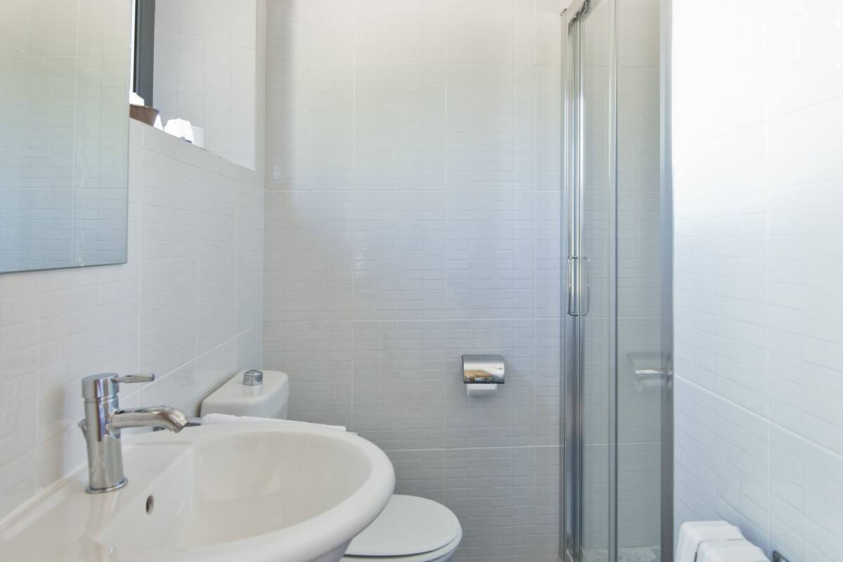 standard double or twin room | bathroom | shower, rainfall showerhead, hair dryer, towels