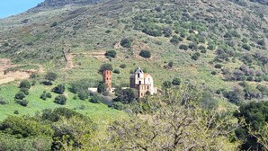 A hilltop with a historic building and ruins, surrounded by greenery and a clear sky. - Port-Vendres: T2 with terrace and parking (Port-Vendres)
