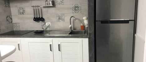 Microwave, coffee/tea maker, cookware/dishes/utensils