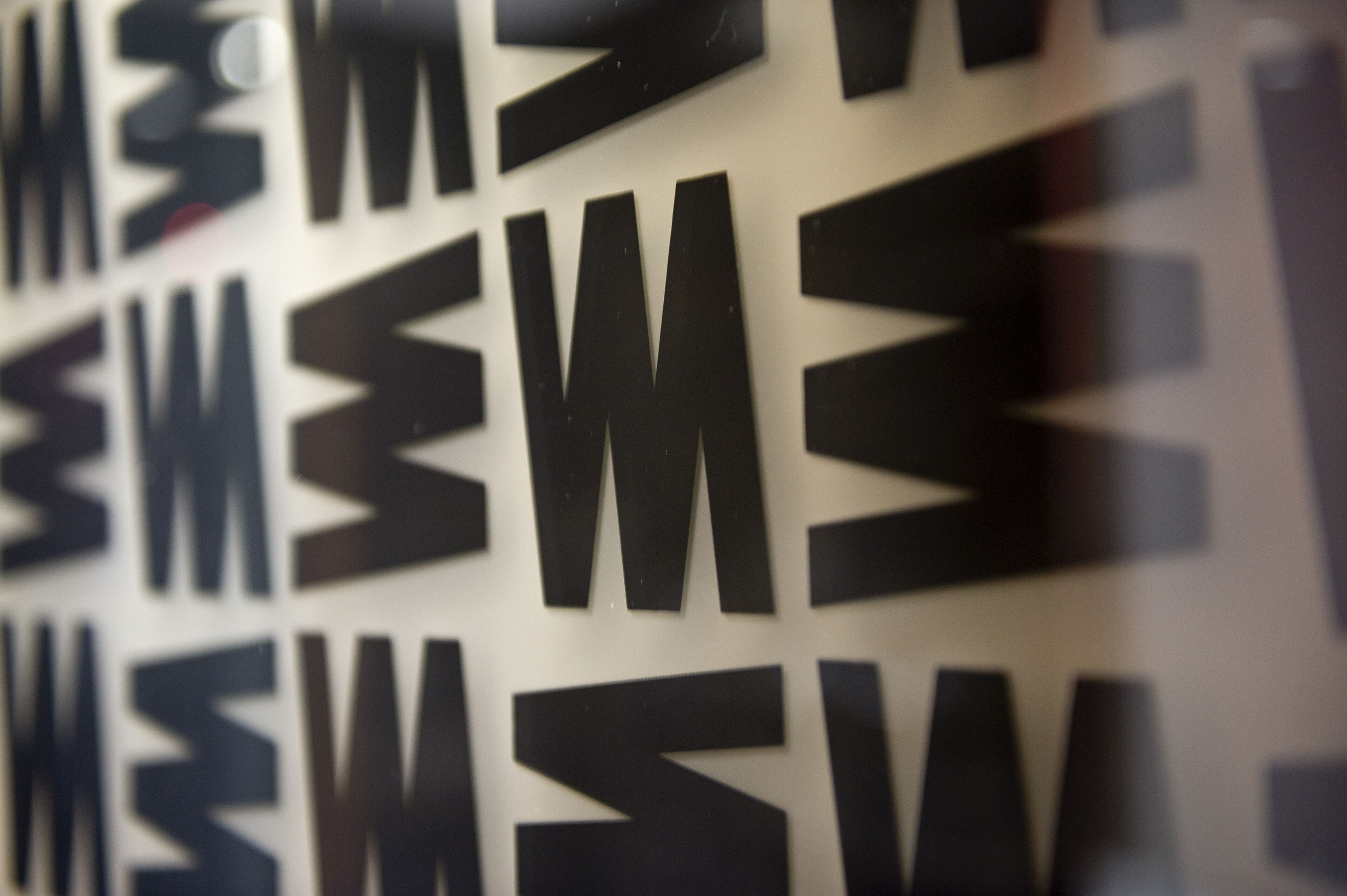 A close-up of a wall with large, bold letters.