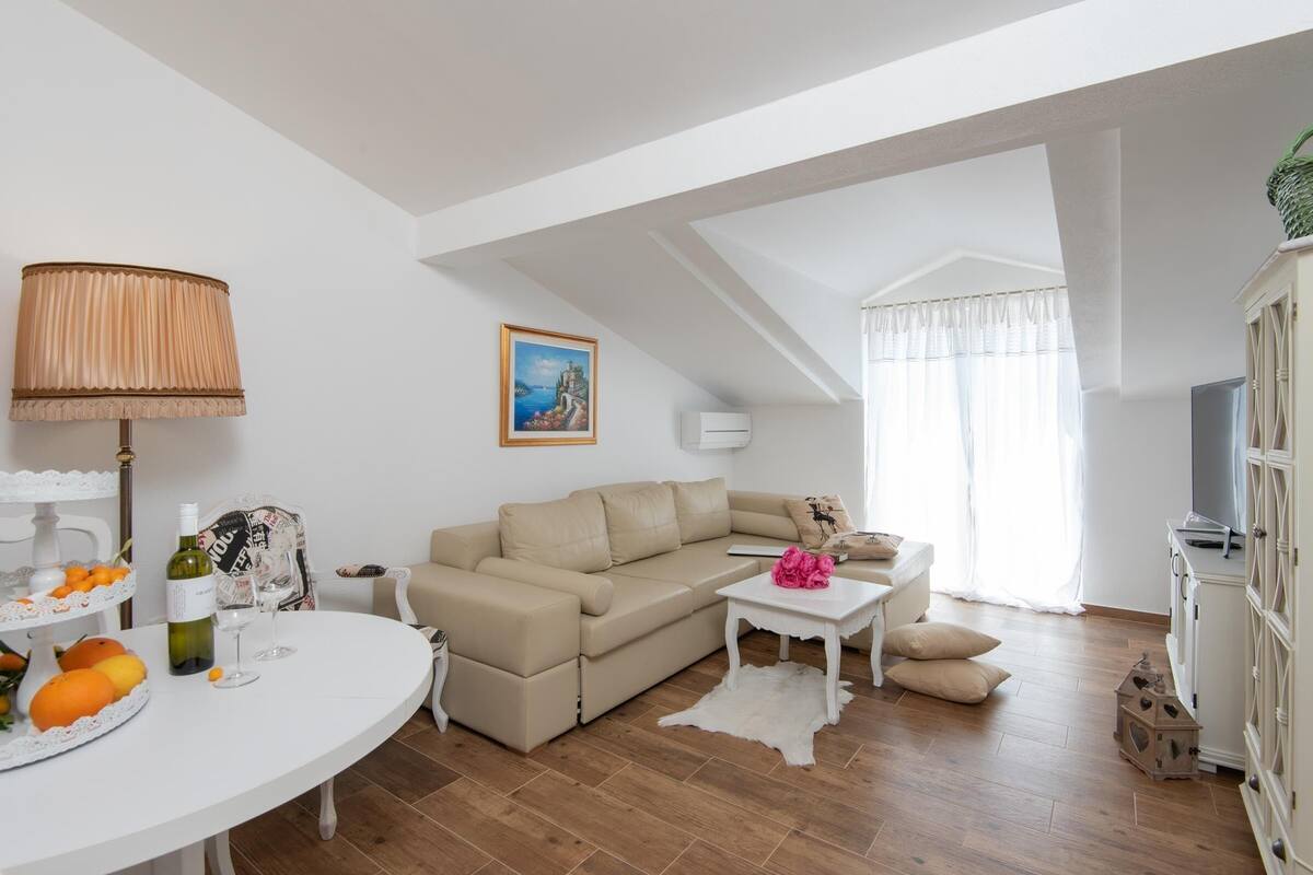 Apartment, 1 Bedroom, Sea View | Living room | Flat-screen TV