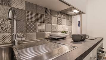 Fridge, oven, coffee/tea maker, cookware/dishes/utensils