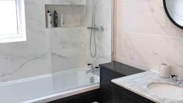 Combined shower/bathtub, hair dryer, towels, soap