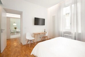 1 bedroom, desk, iron/ironing board, travel crib