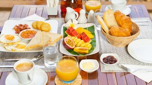 A breakfast table with eggs, toast, bread, and various fruits. -  Angkor Serenity Hotel Siem Reap (Siem Reap)