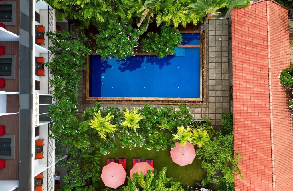 Outdoor pool, open 7:00 AM to 10:00 PM, pool umbrellas, pool loungers