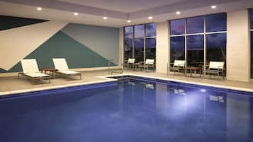 Indoor pool, open 6:00 AM to 10:00 PM, pool loungers