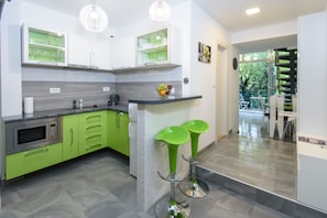 Mini-fridge, microwave, stovetop, coffee/tea maker