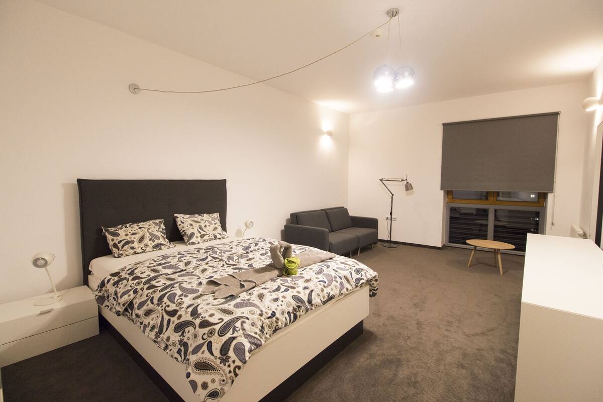 Premier Apartment | Premium bedding, desk, laptop workspace, iron/ironing board
