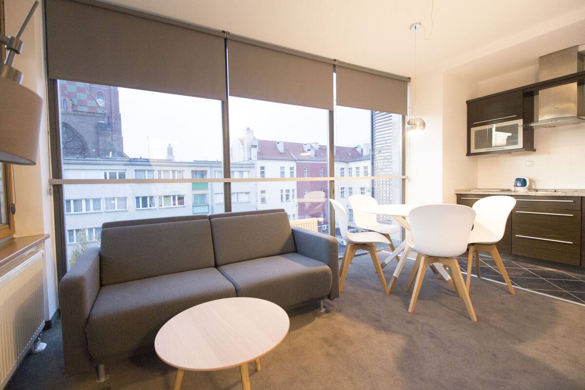 Classic Apartment | Premium bedding, desk, laptop workspace, iron/ironing board