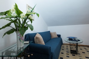 Apartamento conforto | Sala de estar | TV de tela plana 40 polegadas com canais via satélite, TV