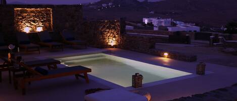 Seasonal outdoor pool, pool loungers