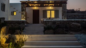 A stone staircase leading to a wooden door with a window above it. - Ortus Light Blue Mykonian Luxury Villa (Mykonos)