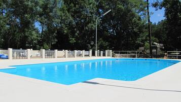 Seasonal outdoor pool, open 10:00 AM to 8:00 PM, pool umbrellas
