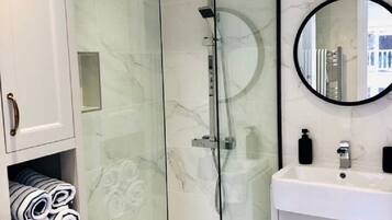 Shower, hair dryer, towels, soap